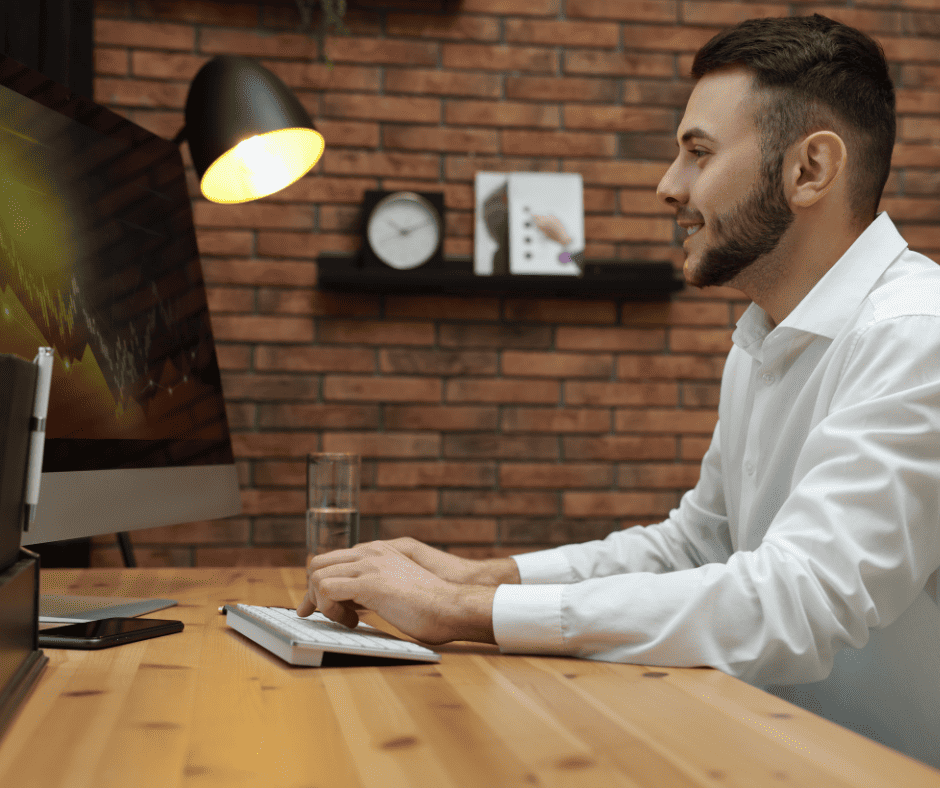 bearded trader examining his charts